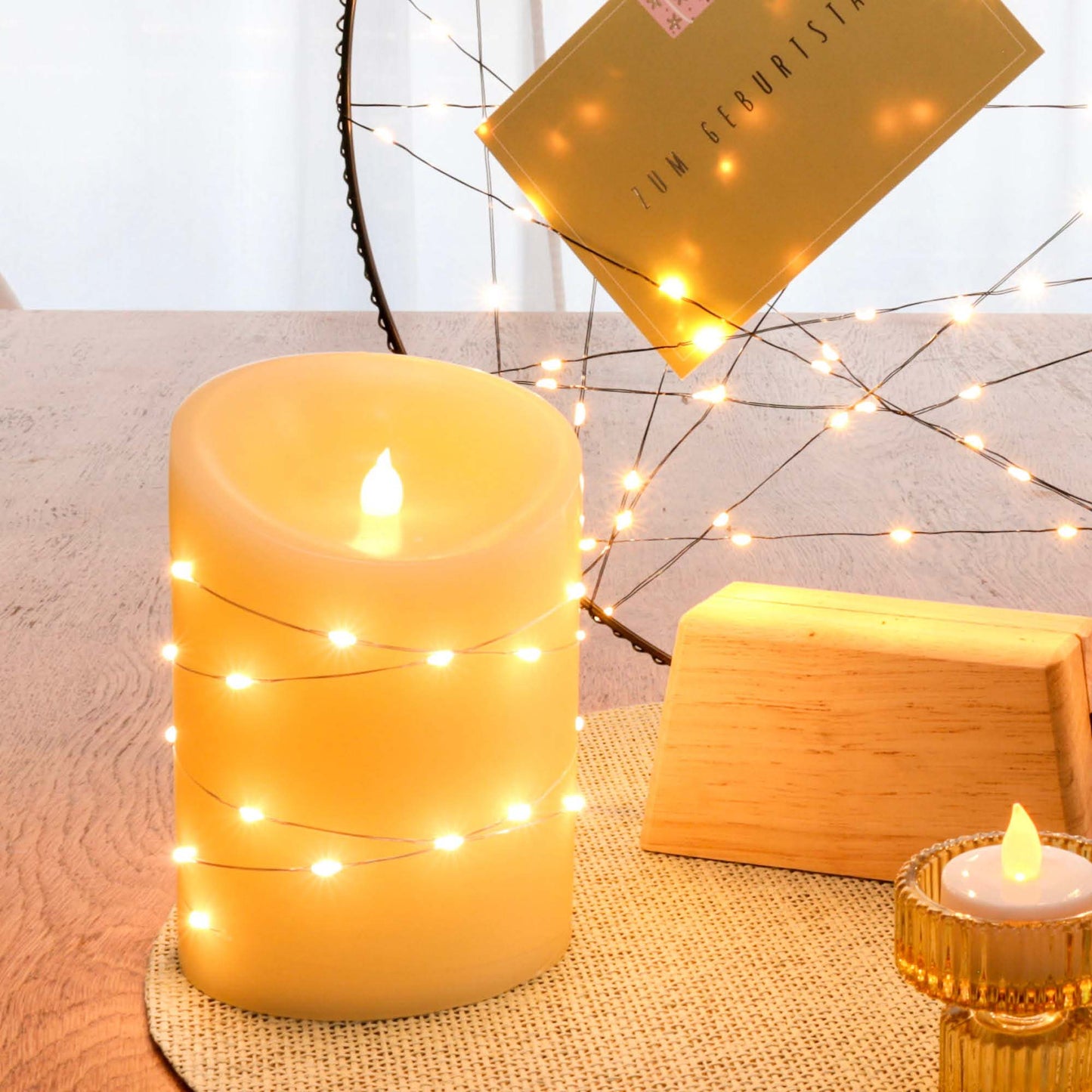 LED-Wachskerze mit Lichterkette "Tautropfen" , H 15cm, D 10cm, 29 + 1 LEDs ww, batteriebetrieben